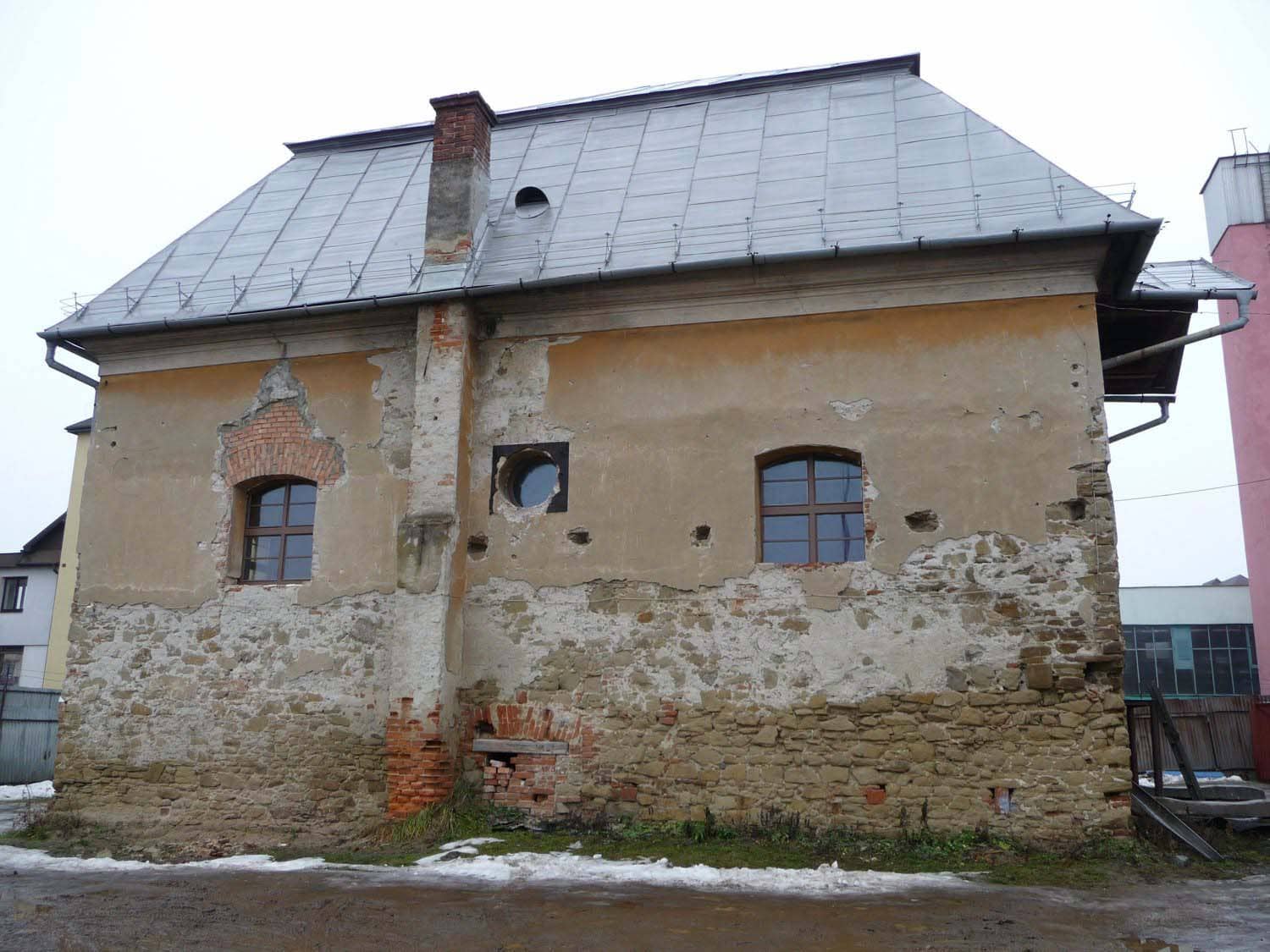 Exterior of Bardejov Old Synagogue showing damage before restoration