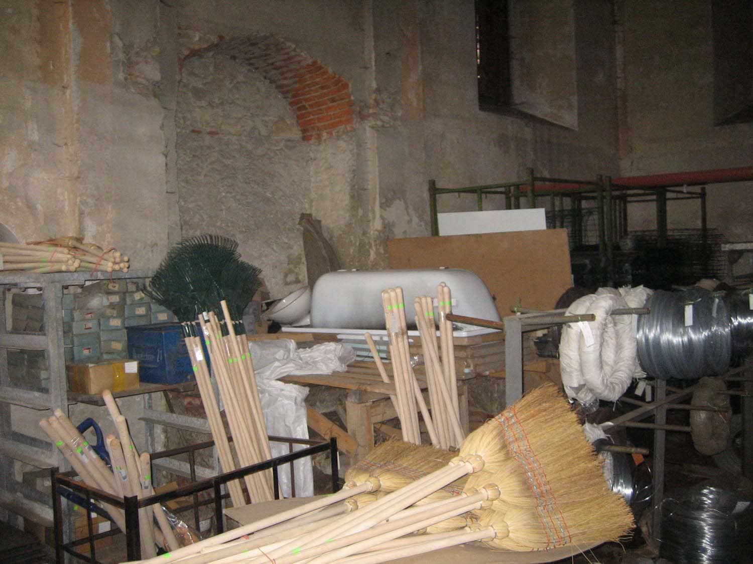 Bardejov Old Synagogue interior Eastern wall showing various building supplies occupying the space before restoration