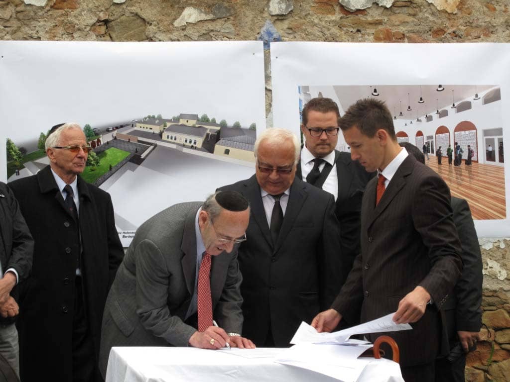 Bardejov Mayor Mr. Boris Hanuscak, and Mr. Fish, signing the agreement to build the Bardejov Holocaust Memorial during the May 2012 gathering in Bardejov