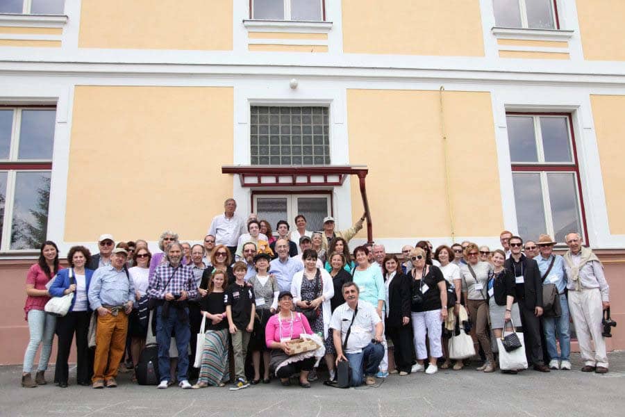 Participants gather for a group photo on the steps of the local school where many group pictures of 'Bardejovers' were taken in the past