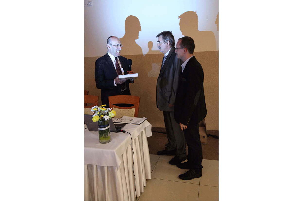 Mr. Fish presents the Memorial Book to Peter Hudak and Pavol Hudak