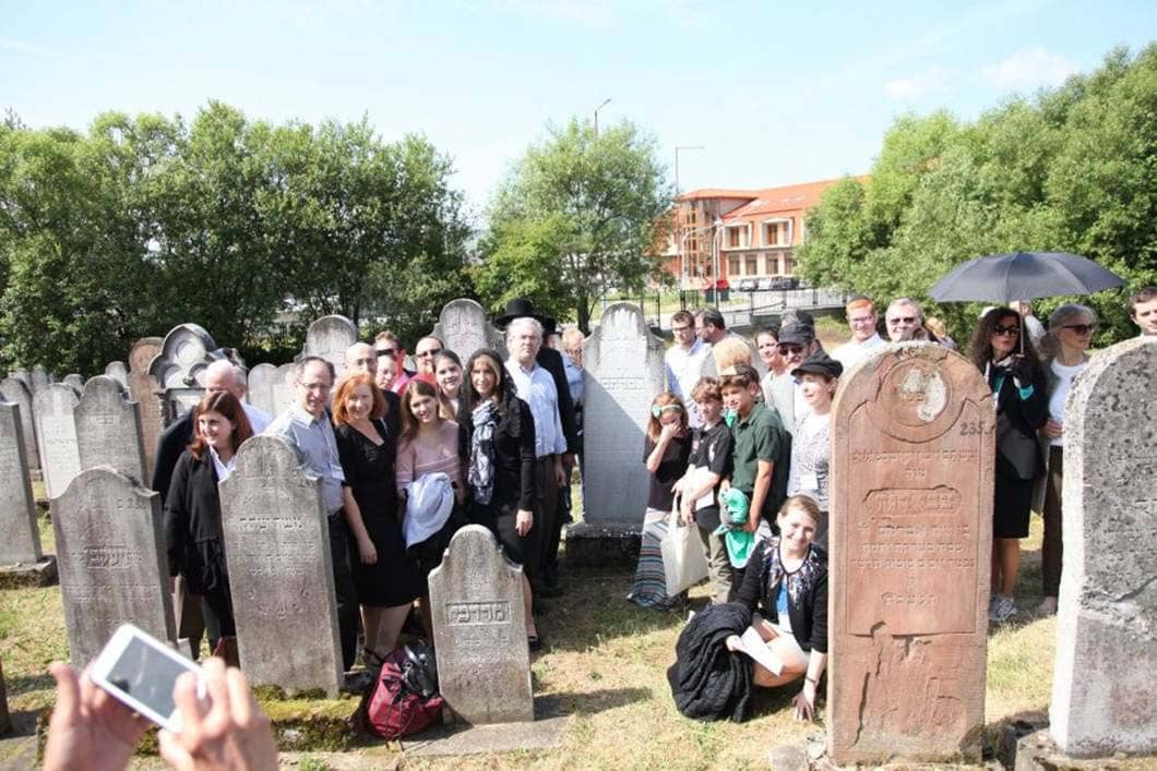 Participants visit the Bardejov Jewish Cemetery on the day of the Dedication