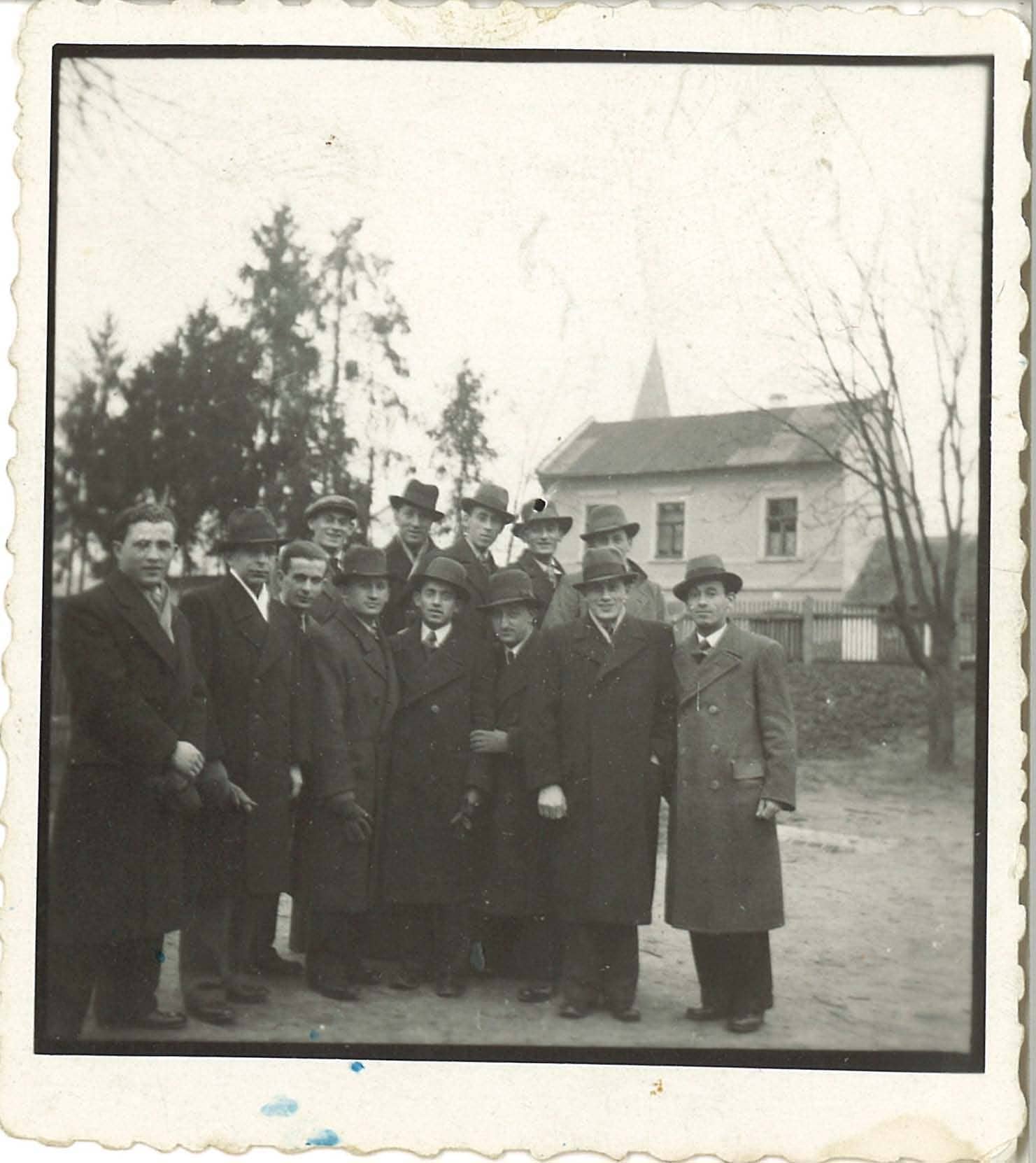 IDENTIFIED: 3rd person from the left is Yitchak Fudem (On back: 1934, Bardejov, Fudem)